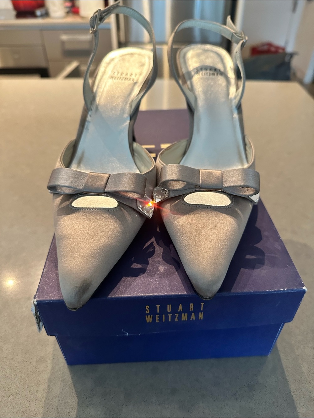 Stuart Weitzman Silver Satin Pointed Toe Slingback Heels with Bow Accent
